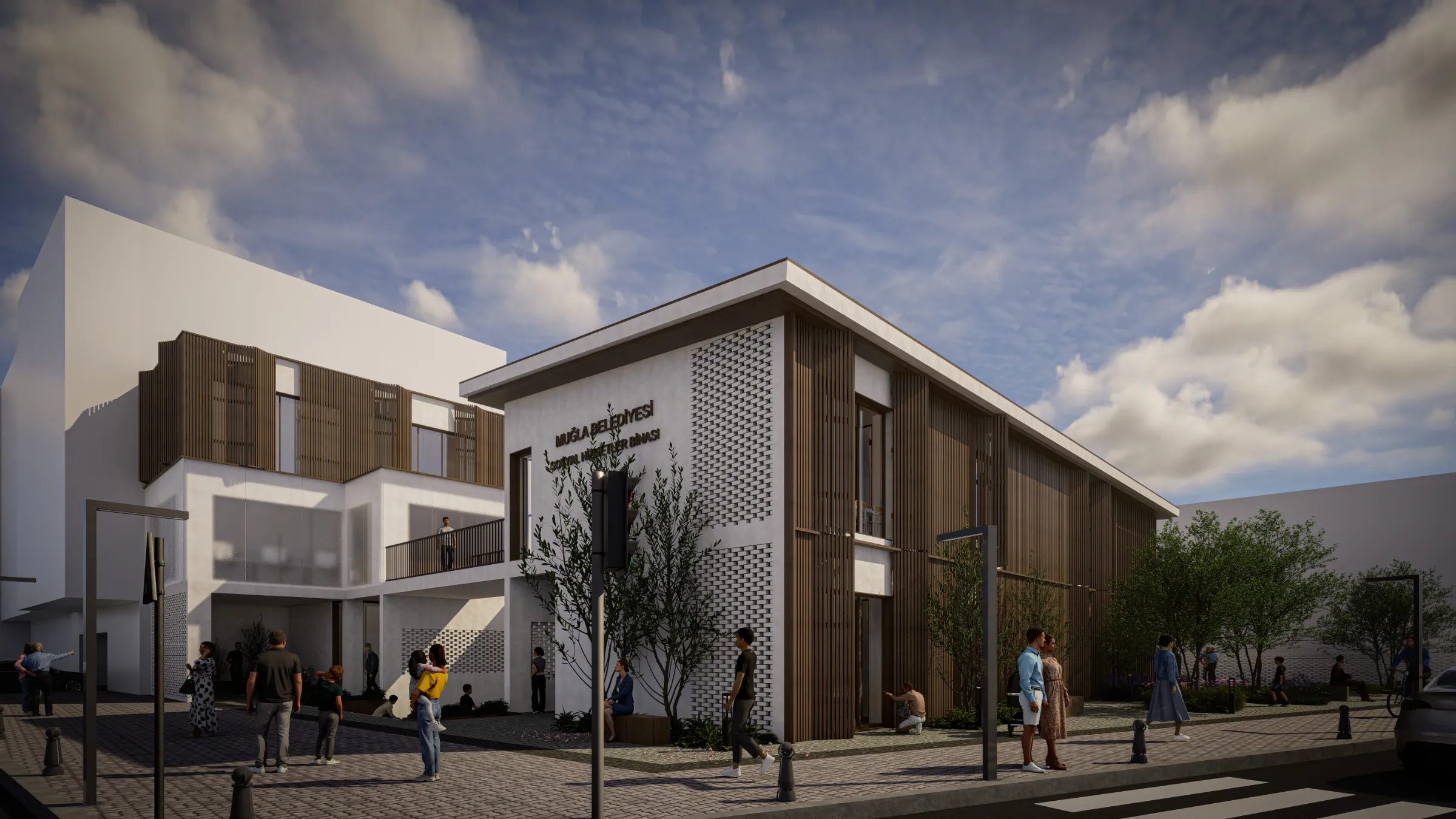 Street-corner view of the white social services building with timber shading and a perforated brick screen, people crossing the paved plaza in front